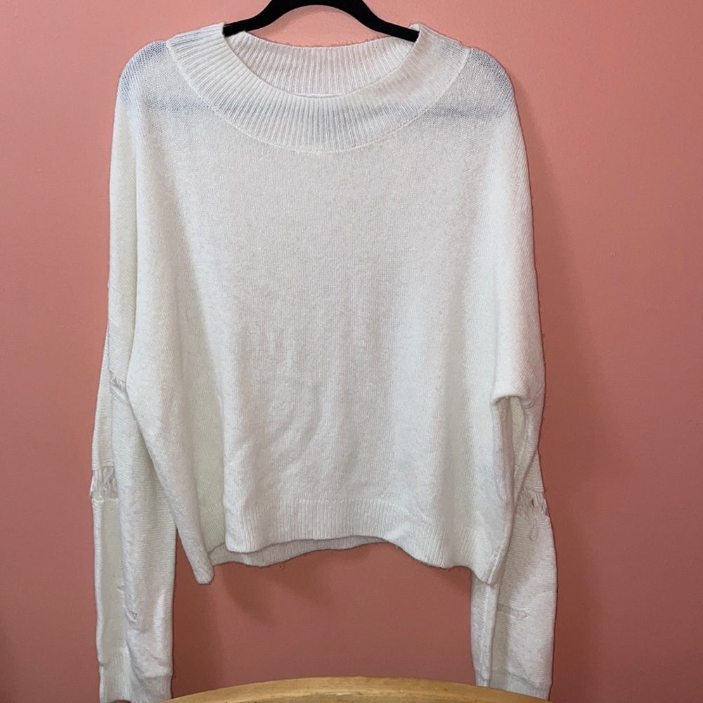 White distressed sleeve sweater